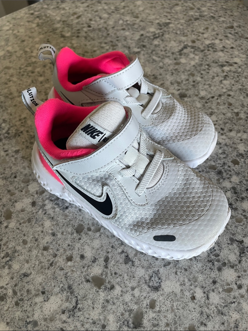 Nike Kids White and Pink Athletic Sneakers with Black Swoosh